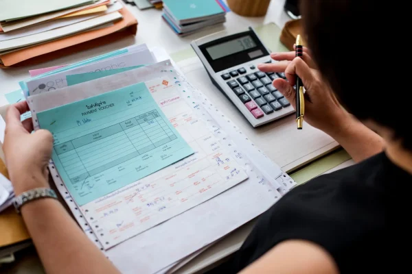 asian-woman-working-through-paperwork (1)